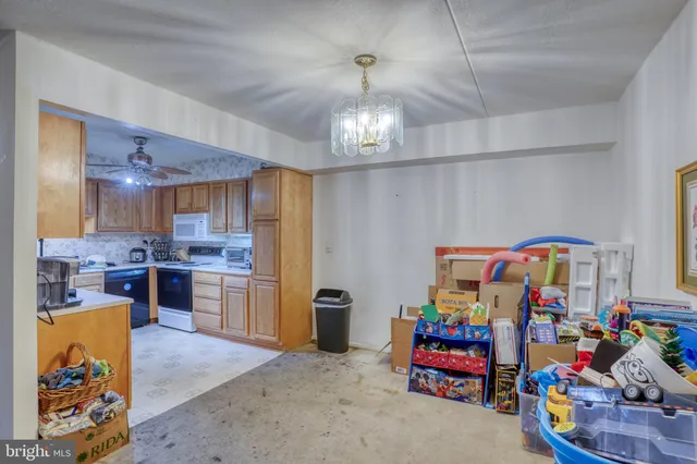 a kitchen with a sink stove and refrigerator