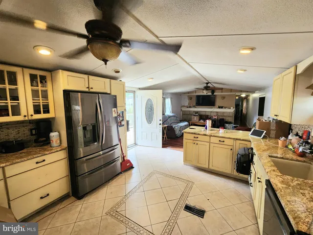 a kitchen with stainless steel appliances granite countertop a stove and a sink