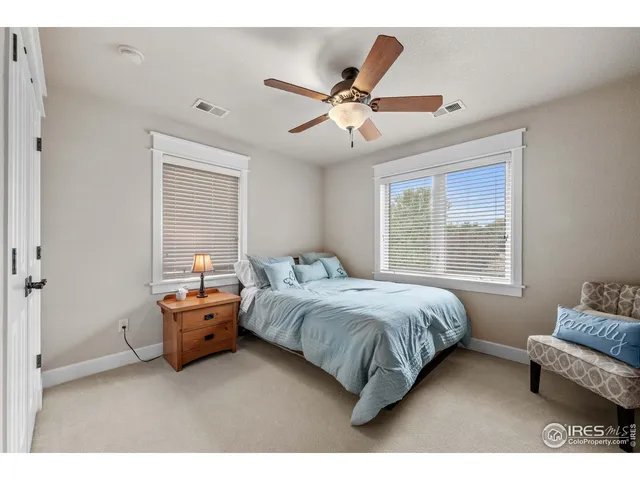 a bathroom with a granite countertop sink toilet a mirror a shower and a bathtub