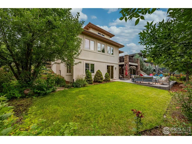 a view of a chairs and table in a yard