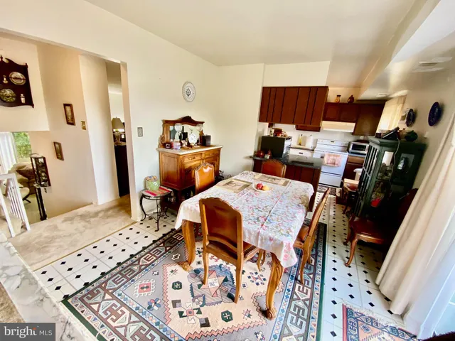 a bed room with a bed a couch and dresser