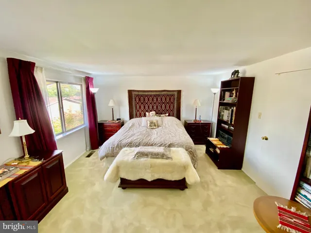 a bedroom with a bed and furniture