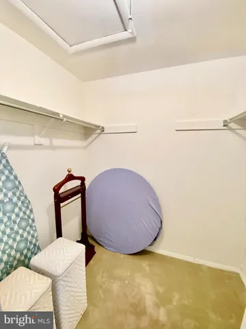 a bathroom with a toilet and a mirror