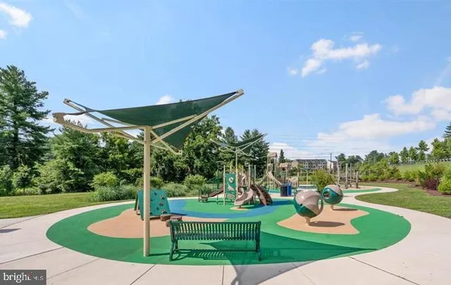 a park view with a fountain and garden