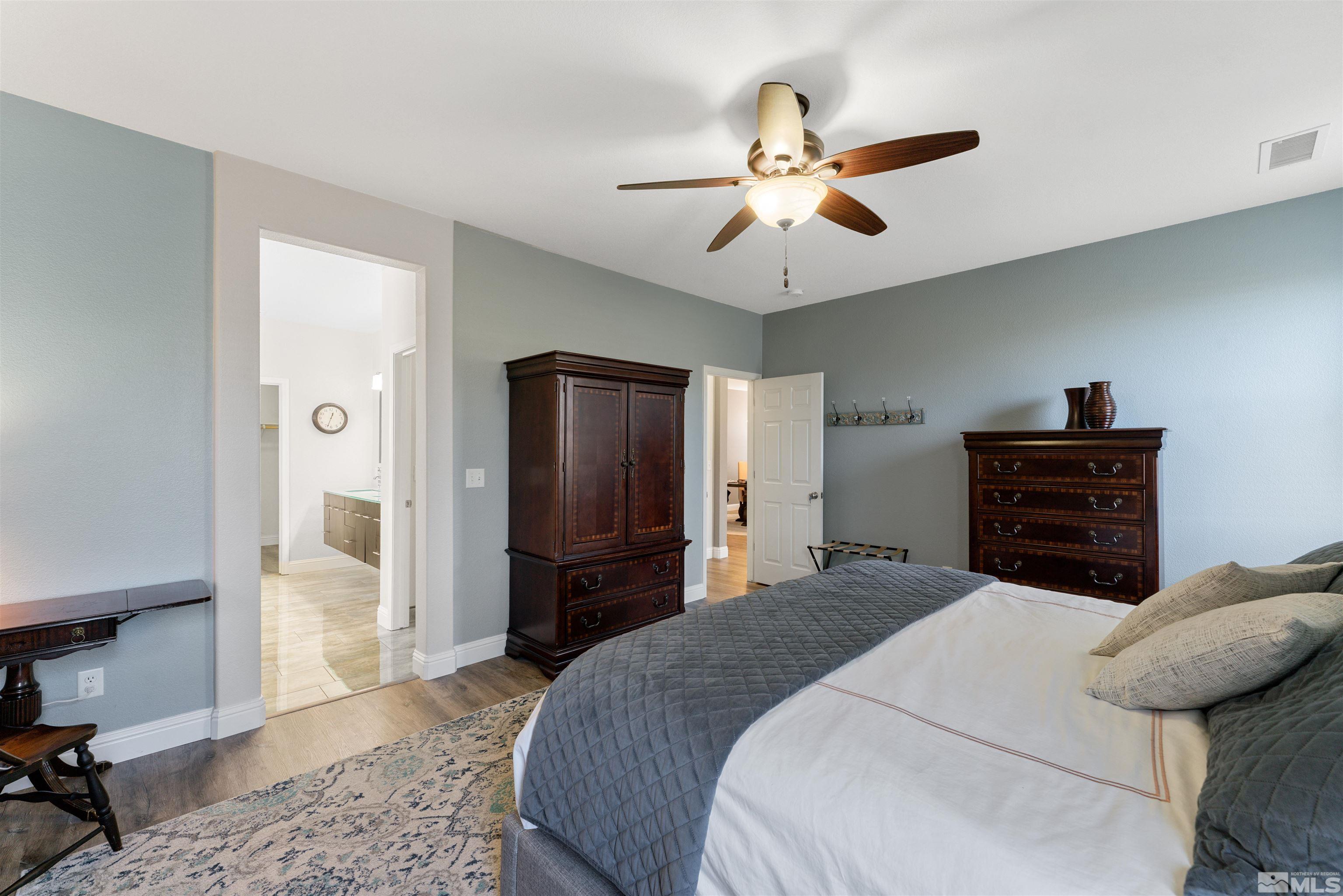 11475 Verazae Drive Reno, NV 89521 - Photo 11 of 40 a bedroom with a bed dresser and a window