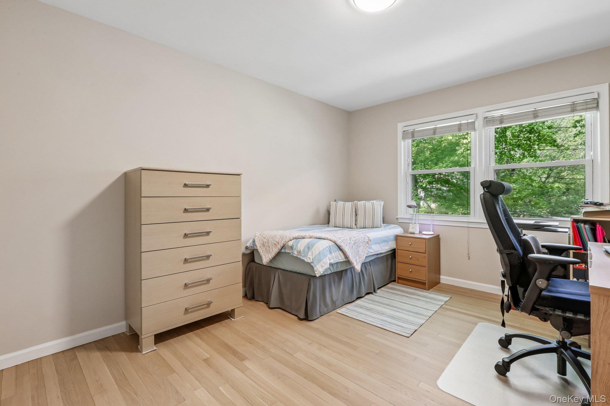 62 Mohegan Road Larchmont, NY 10538 - Photo 37 of 46 a bedroom with a bed and a desk
