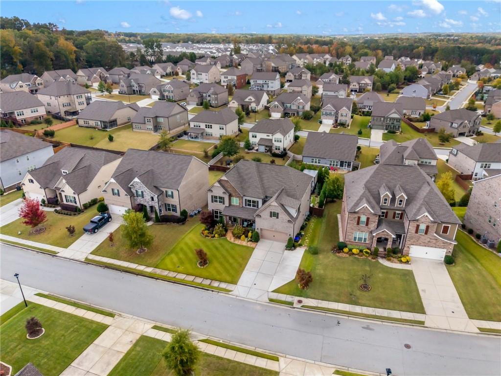 4450 Woodward Walk Lane Suwanee, GA 30024 - Photo 47 of 52 an aerial view of residential houses with outdoor space