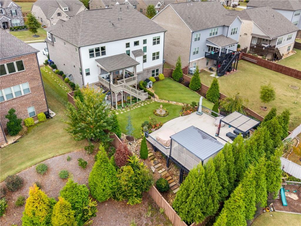 4450 Woodward Walk Lane Suwanee, GA 30024 - Photo 48 of 52 an aerial view of a house with a swimming pool