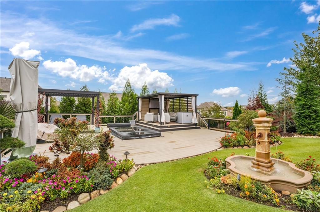 4450 Woodward Walk Lane Suwanee, GA 30024 - Photo 49 of 52 a view of a swimming pool with a patio