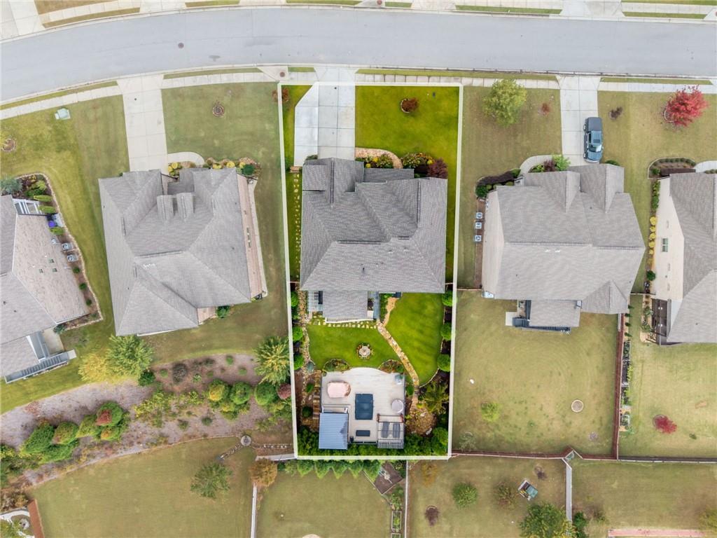 4450 Woodward Walk Lane Suwanee, GA 30024 - Photo 52 of 52 an aerial view of a house with a swimming pool