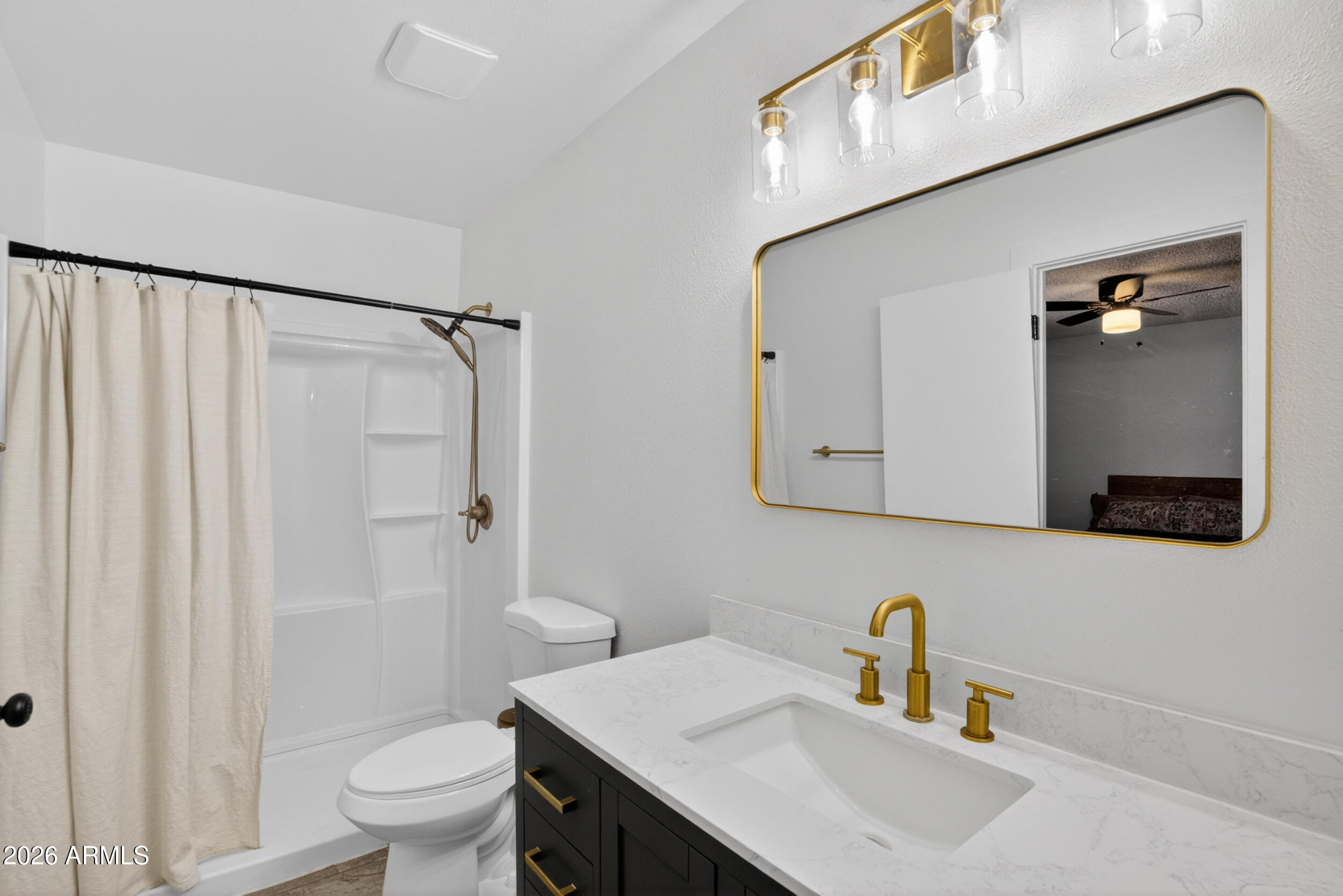5007 South Terrace Road Tempe, AZ 85282 - Photo 4 of 33 a bathroom with a sink a toilet and shower