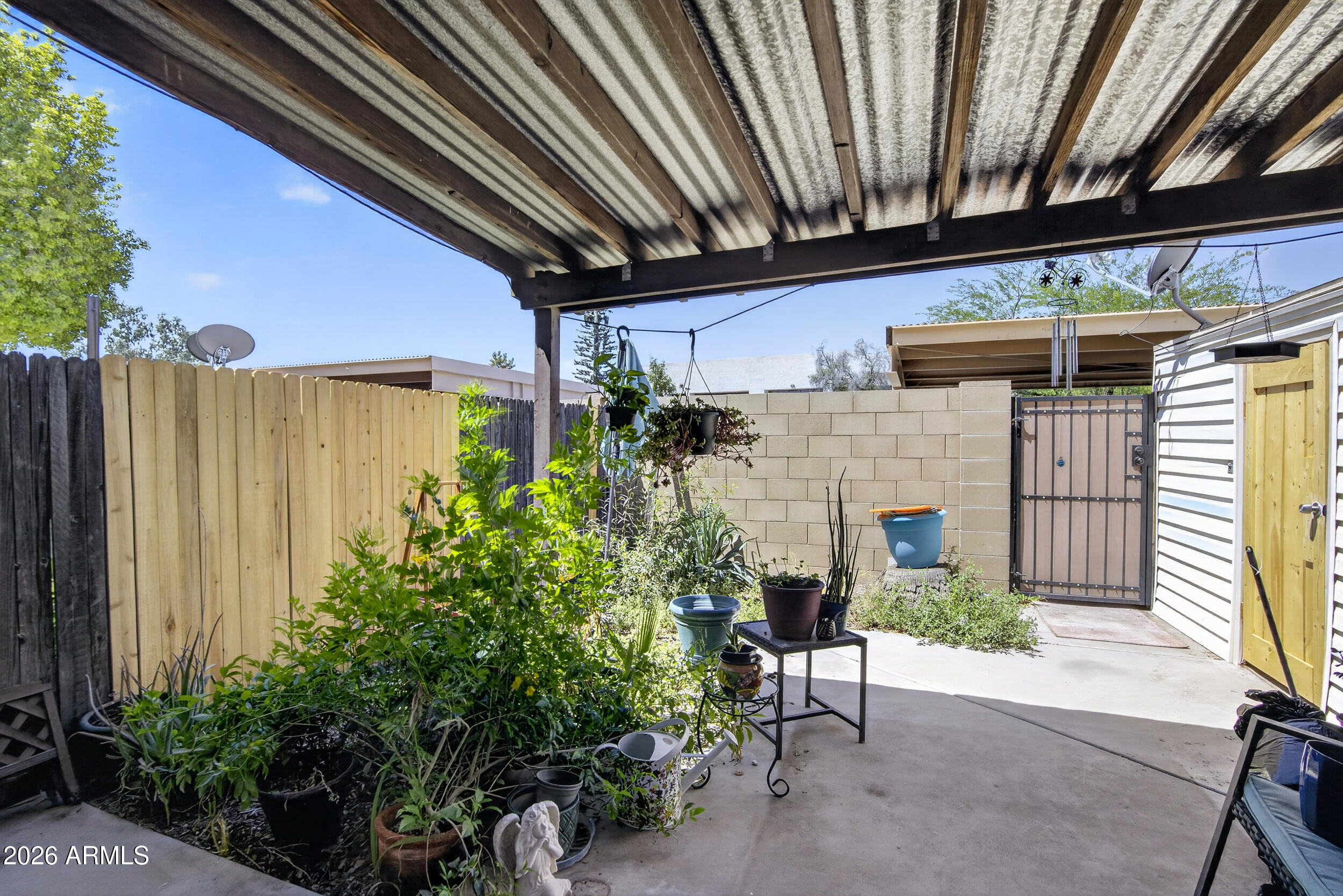 5007 South Terrace Road Tempe, AZ 85282 - Photo 5 of 33 a view of a patio with table and chairs and potted plants