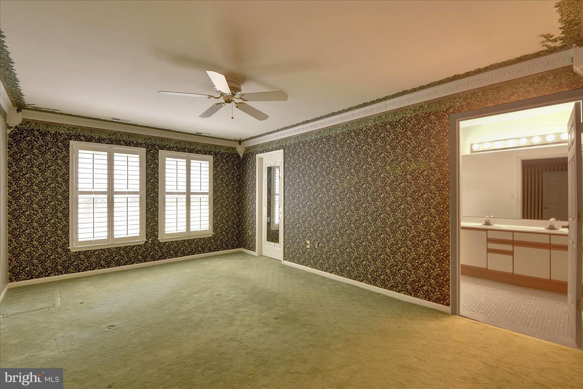 849 Rudder Way Annapolis, MD 21401 - Photo 18 of 26 Main level Master, plantation shutters, Crown mold