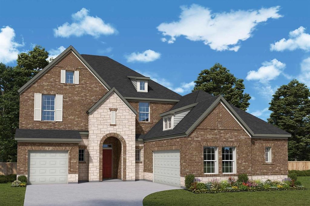 1905 Foothill Road Rockwall, TX 75087 - Photo 1 of 3 a front view of a house with garden