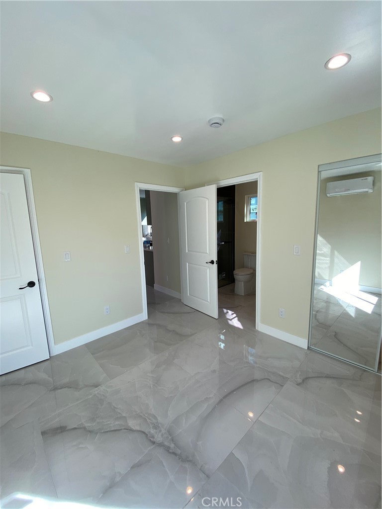18020 Welby Reseda, CA 91335 - Photo 12 of 16 an empty room with an entryway and closet area
