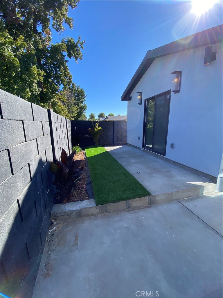 18020 Welby Reseda, CA 91335 - Photo 14 of 16 a view of backyard with outdoor seating and green space
