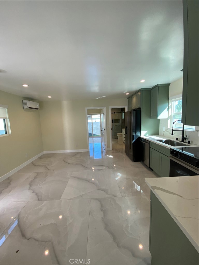 18020 Welby Reseda, CA 91335 - Photo 2 of 16 a view of a kitchen with a sink and cabinets
