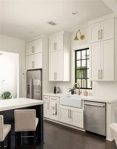 a living room with fireplace furniture and a large window