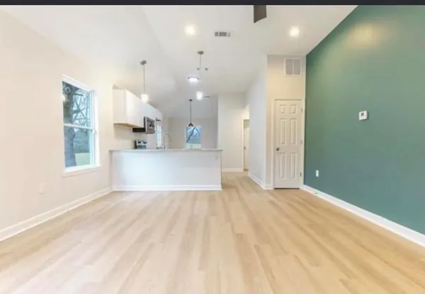 a bathroom with a sink a toilet and bathtub