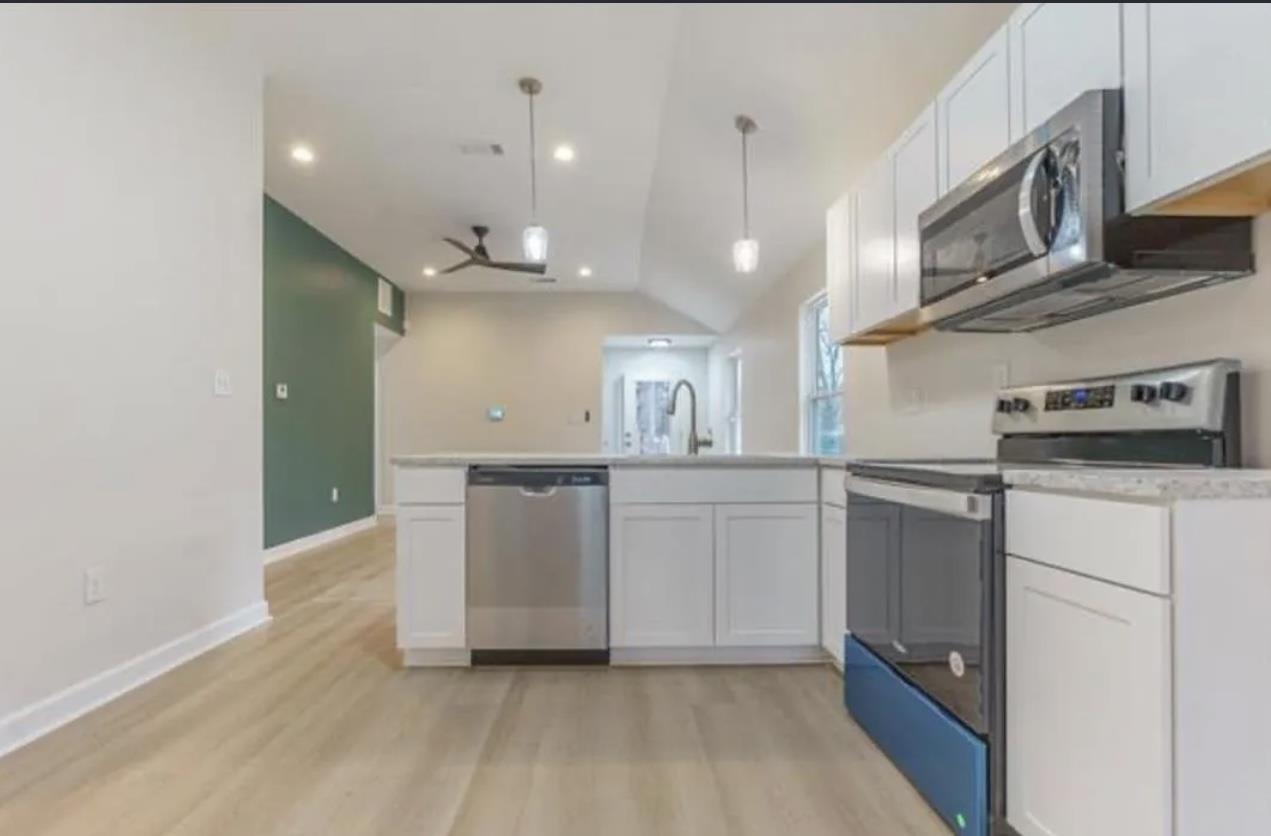 4100 New Willow Road Memphis, TN 38111 - Photo 2 of 6 a kitchen with cabinets and wooden floor
