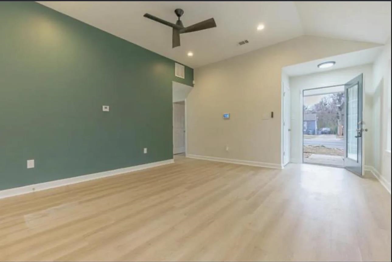 4100 New Willow Road Memphis, TN 38111 - Photo 4 of 6 an empty room with wooden floor and a hallway