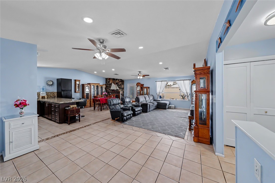 3107 Trueno Road Henderson, NV 89014 - Photo 13 of 37 An inviting open-concept living area boasts a cohesive design and abundant space for entertaining.