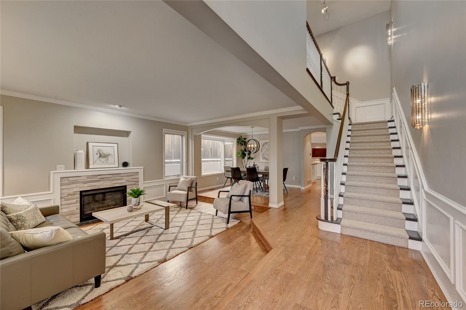 358 Steele Street Denver, CO 80206 - Photo 2 of 30 a living room with furniture and a fireplace