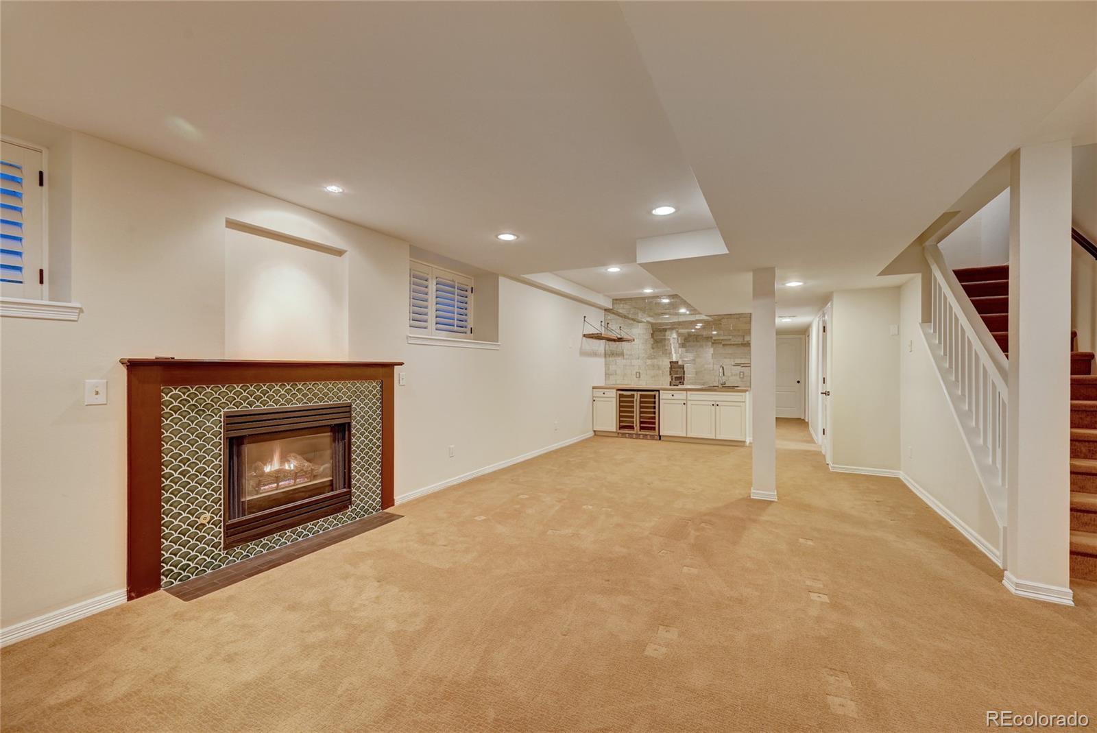 358 Steele Street Denver, CO 80206 - Photo 23 of 30 a view of an empty room with a fireplace