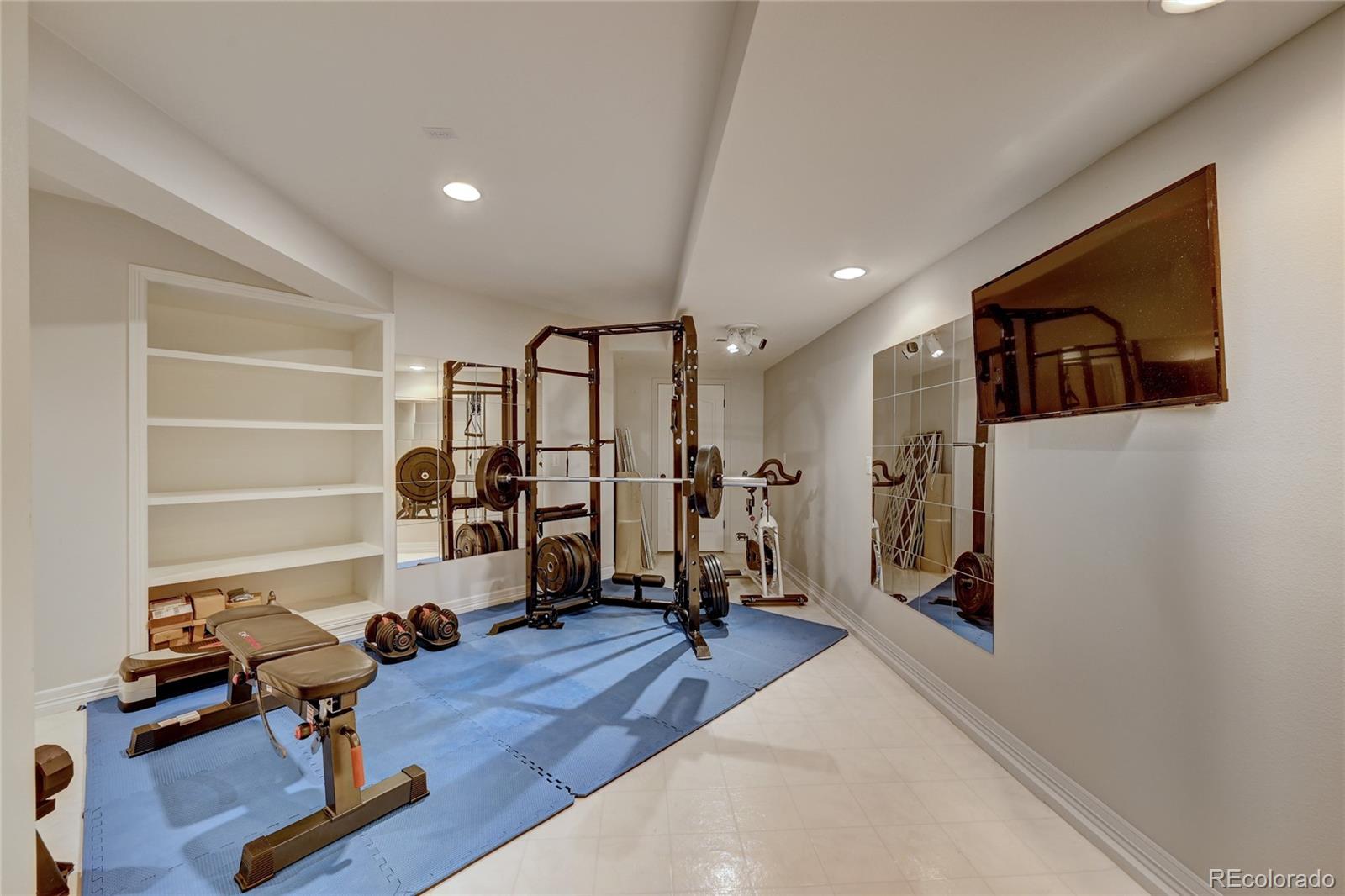 358 Steele Street Denver, CO 80206 - Photo 26 of 30 a view of a room with gym equipment
