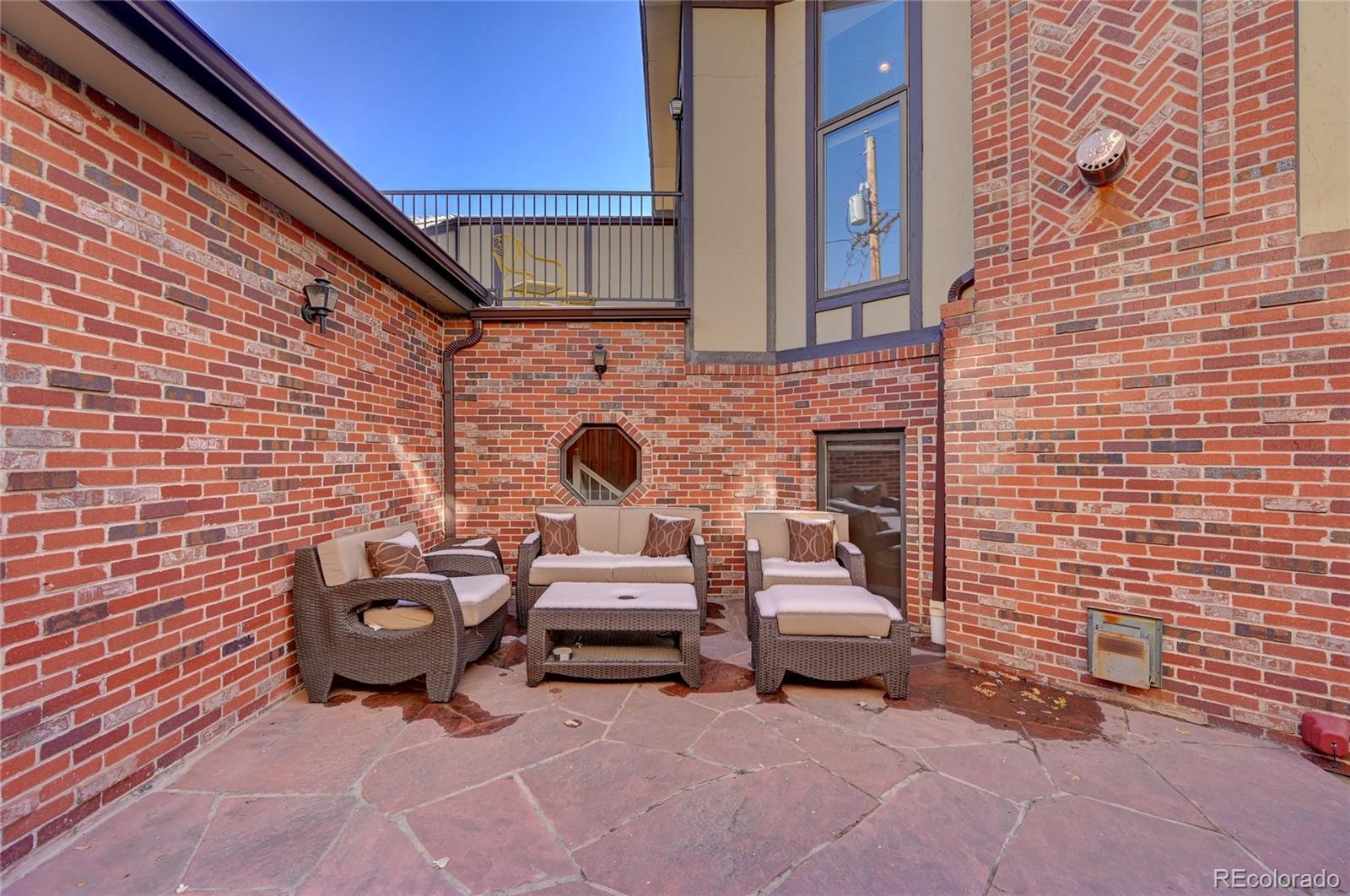 358 Steele Street Denver, CO 80206 - Photo 28 of 30 a view of a patio with table and chairs and potted plants