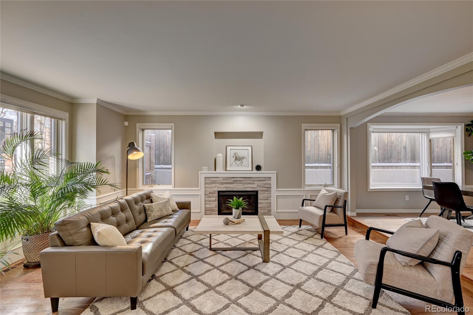 358 Steele Street Denver, CO 80206 - Photo 5 of 30 a living room with furniture fireplace and window