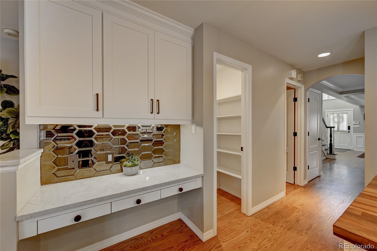 358 Steele Street Denver, CO 80206 - Photo 8 of 30 a view of an entryway with wooden floor