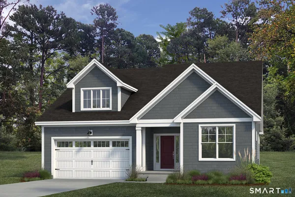 a front view of a house with garage