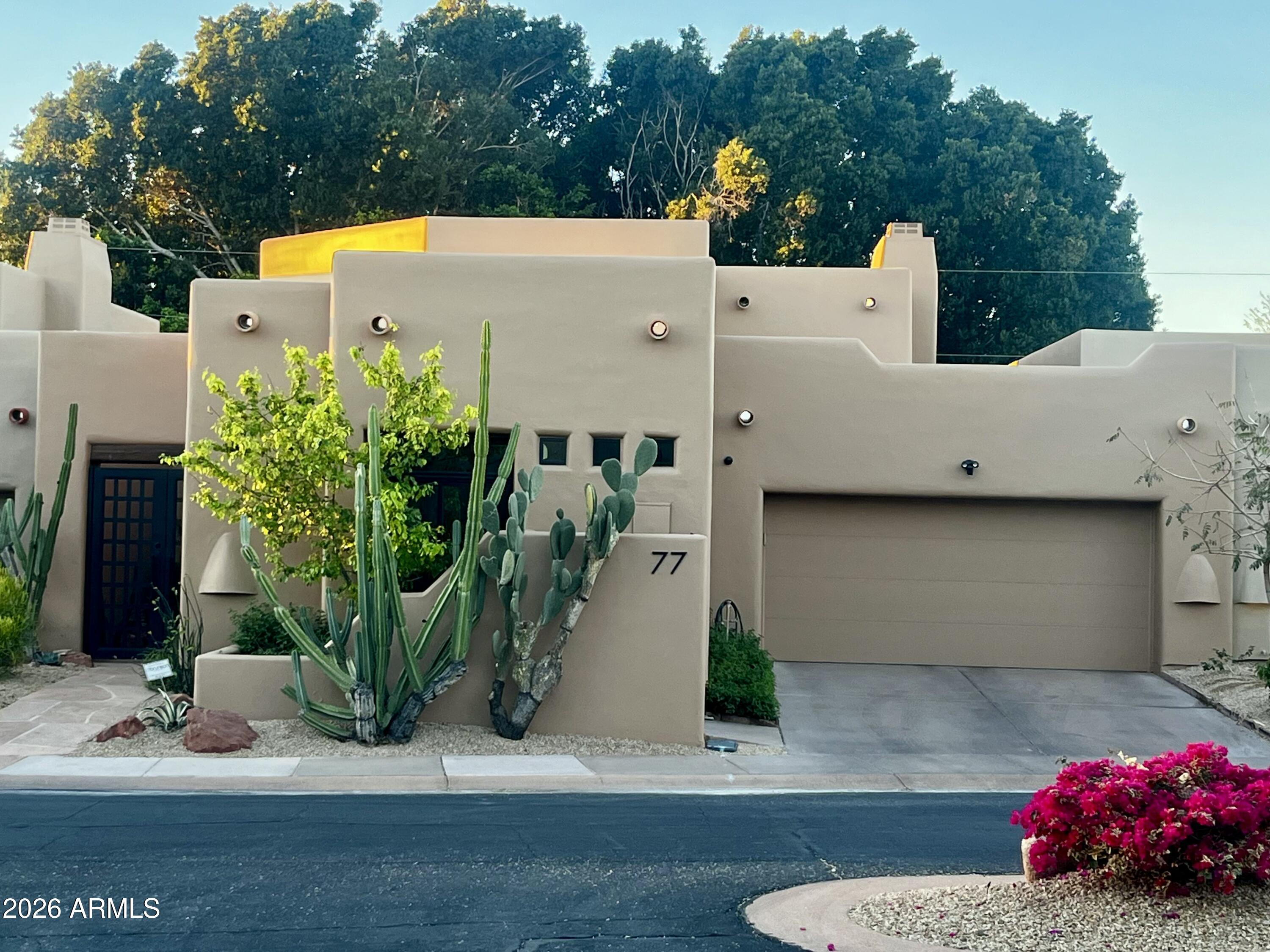 6711 East Camelback Road, Unit 77 Scottsdale, AZ 85251 - Photo 1 of 3 a view of a house with backyard and sitting area