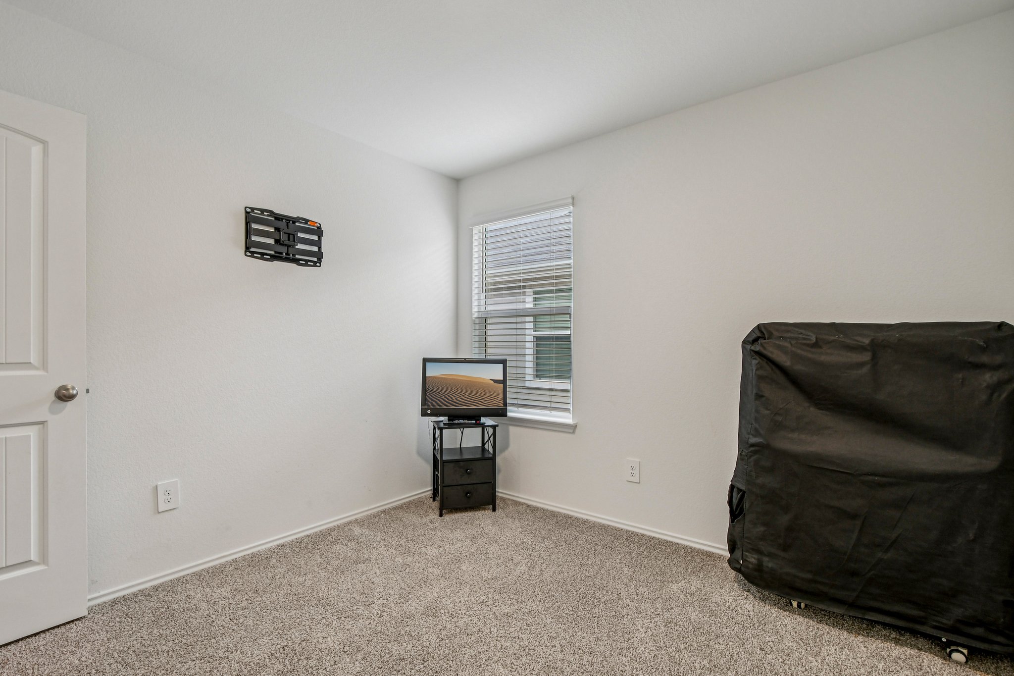 519 Sandringham Loop Kyle, TX 78640 - Photo 19 of 32 Bedroom featuring carpet and baseboards