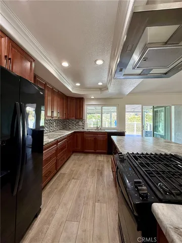 a view of a house with a wooden deck