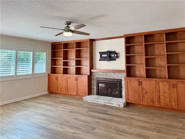 a bathroom with a granite countertop sink and shower