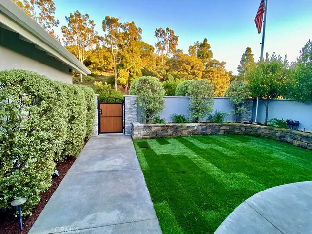 a kitchen with stainless steel appliances granite countertop wooden cabinets a counter top space and stainless steel appliances