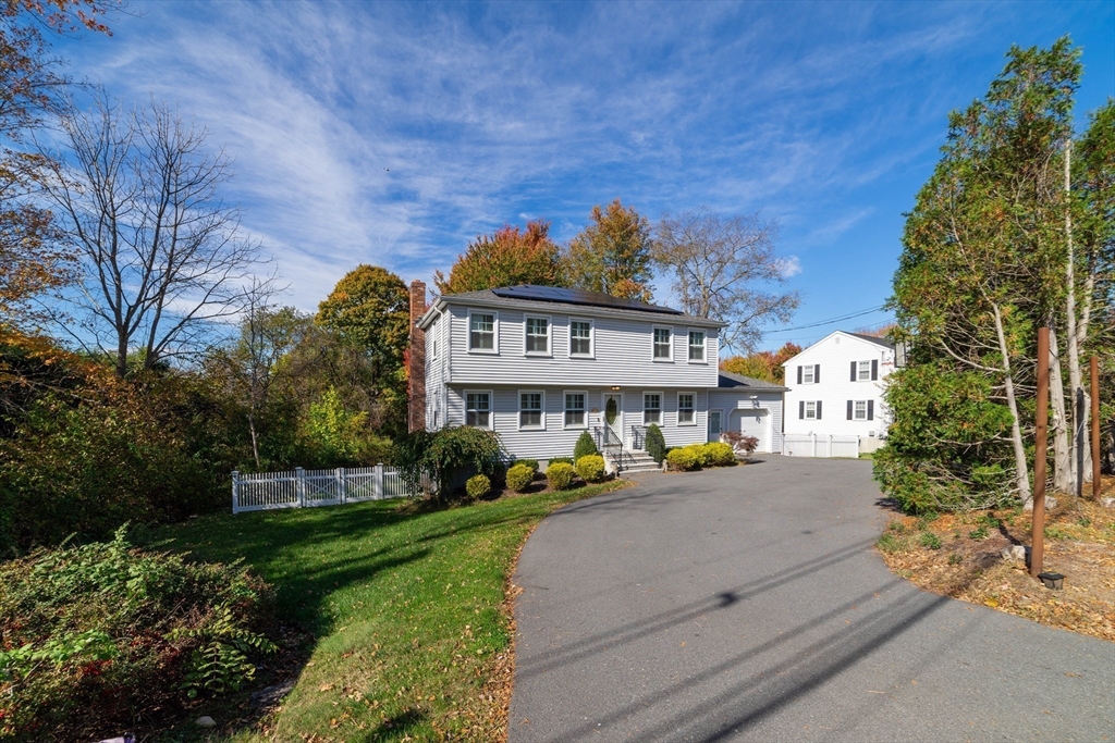 1904 Washington Street Canton, MA 02021 - Photo 1 of 39 a front view of a house with a garden