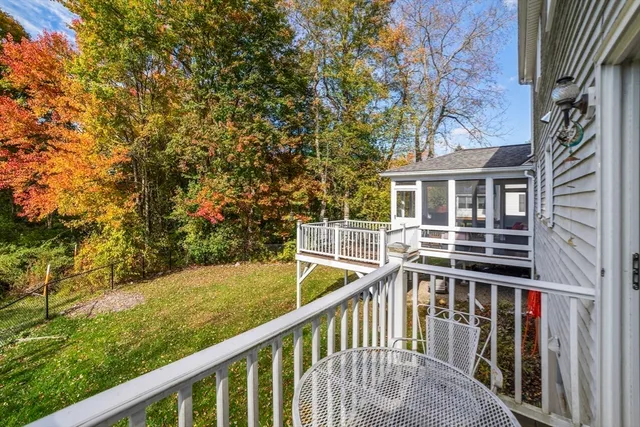 a view of a balcony with two chairs