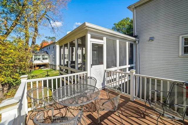 a view of a wooden deck and a yard