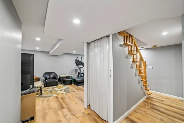 a view of a livingroom with furniture and a window