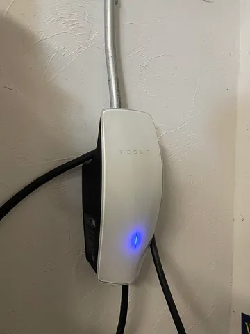 a view of a house with backyard sitting area and garden