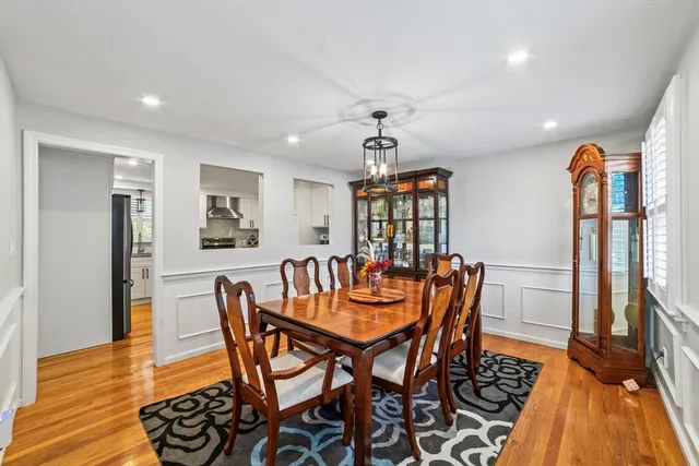 a dining room with furniture and wooden floor