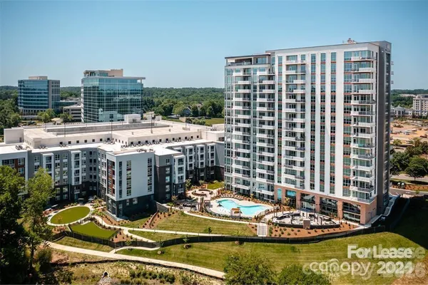 a view of a balcony with dining table and chairs