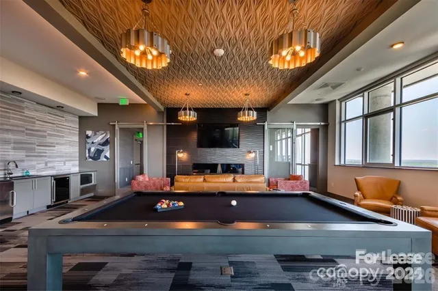 a room with furniture and flat screen tv