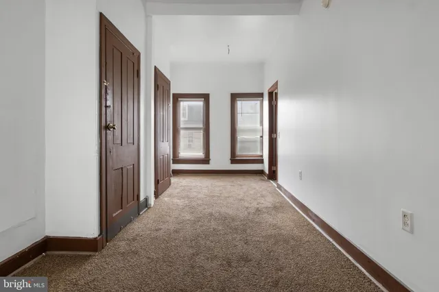 an empty room with windows