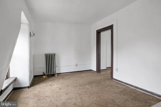 a view of empty room with stairs