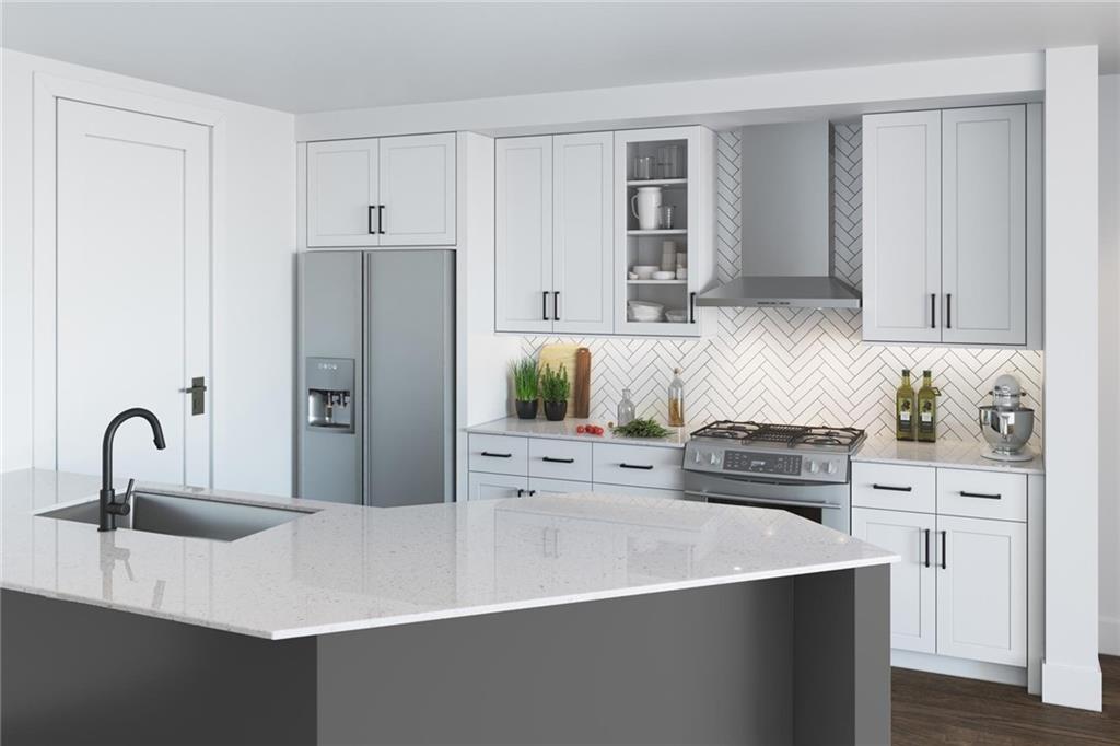 1000 Park Avenue Northeast, Unit 1904 Atlanta, GA 30326 - Photo 2 of 37 a kitchen with stainless steel appliances a sink a stove and cabinets