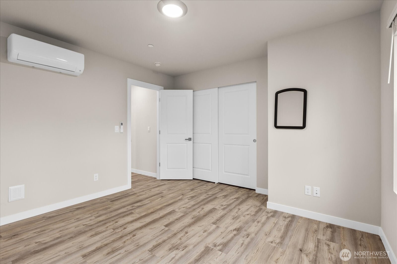 23413 Edmonds Way, Unit A2 Edmonds, WA 98026 - Photo 27 of 40 a view of room with walk in closet and wooden floor